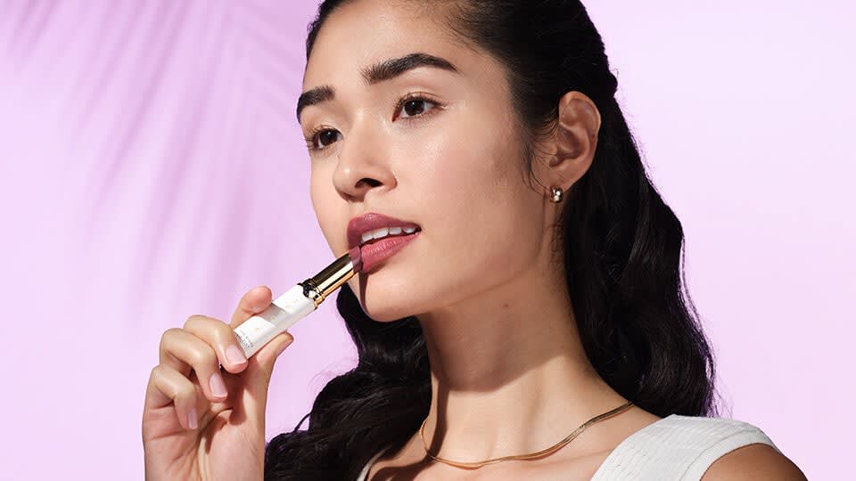 Model applying The Kissu Lip Tint