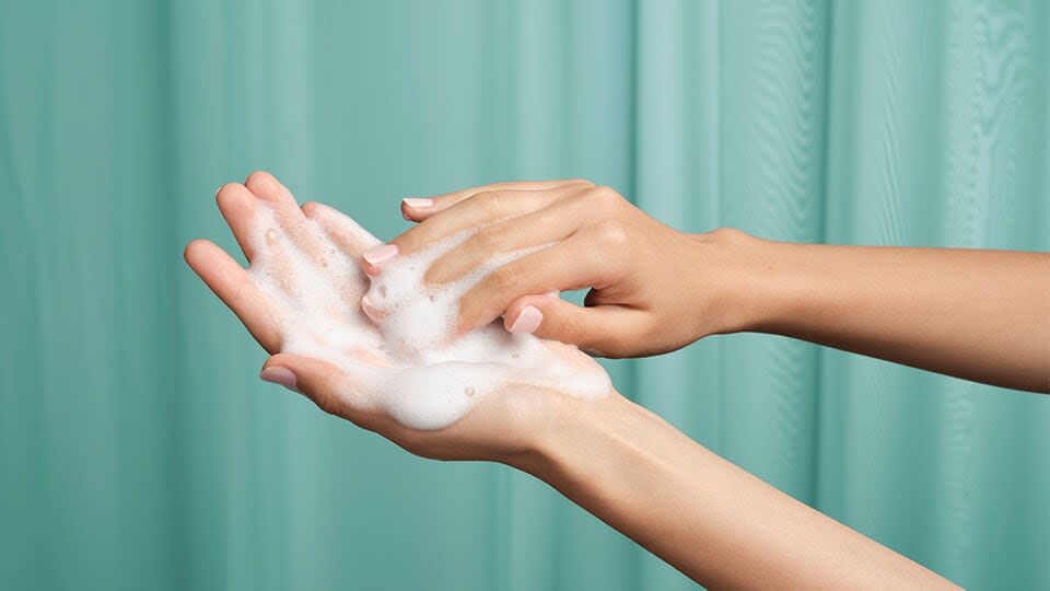 The Matcha Cleanse texture on model's hands.
