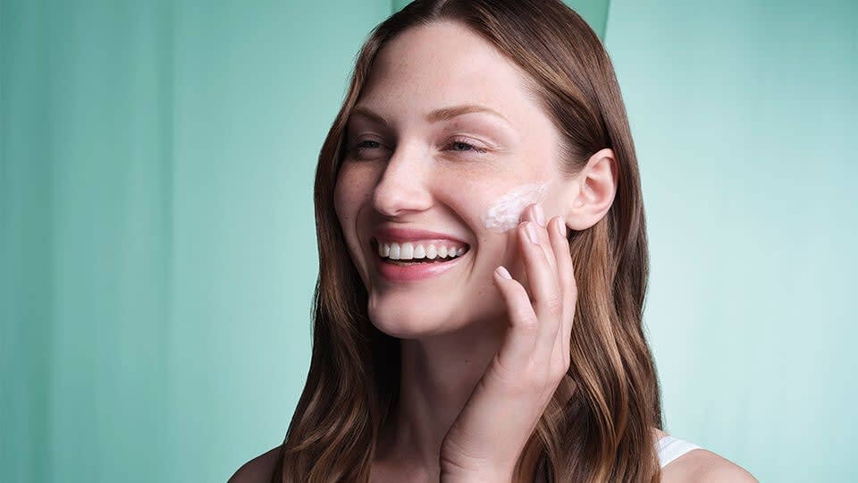 Model applying The Water Cream.