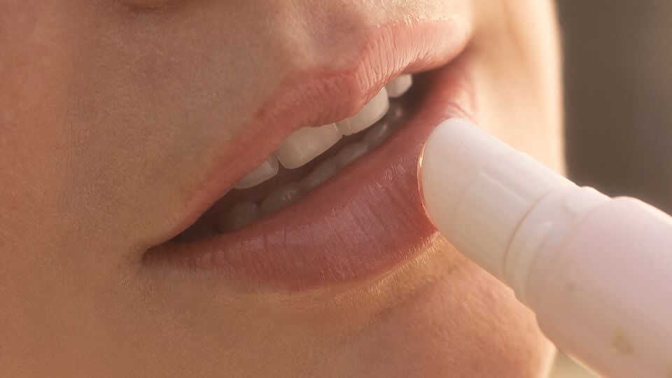 Model applying The Kissu Lip Treatment