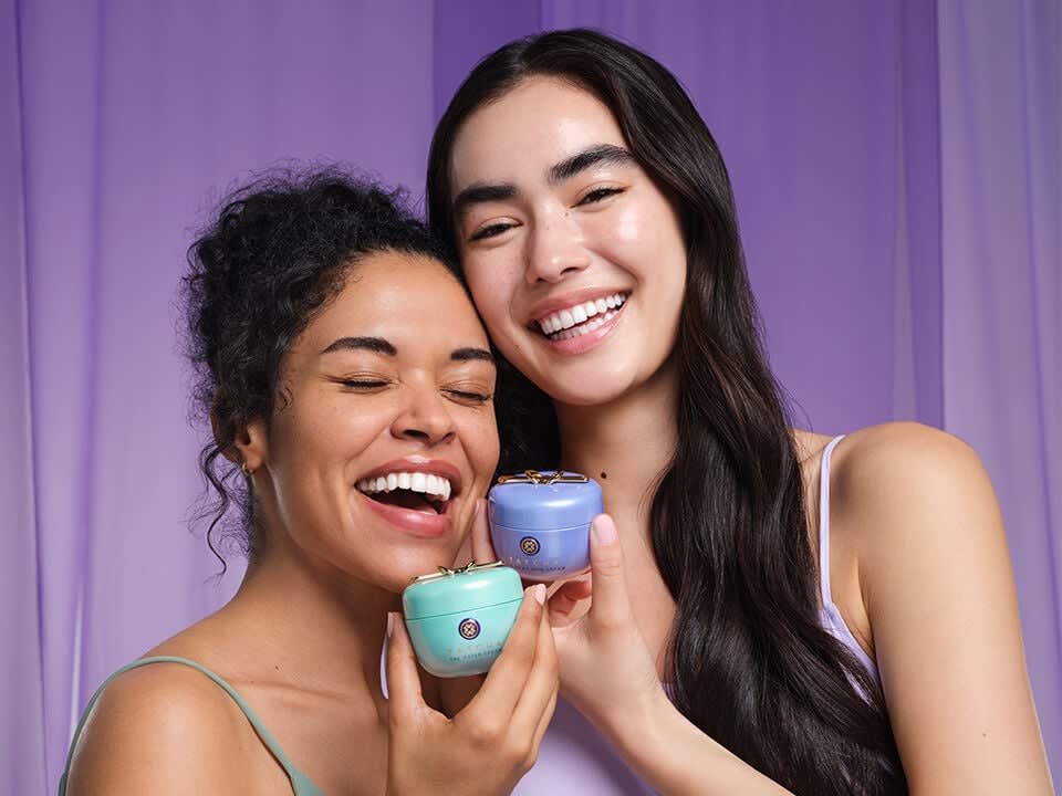 Models posing with The Water Cream and The Dewy Skin Cream.