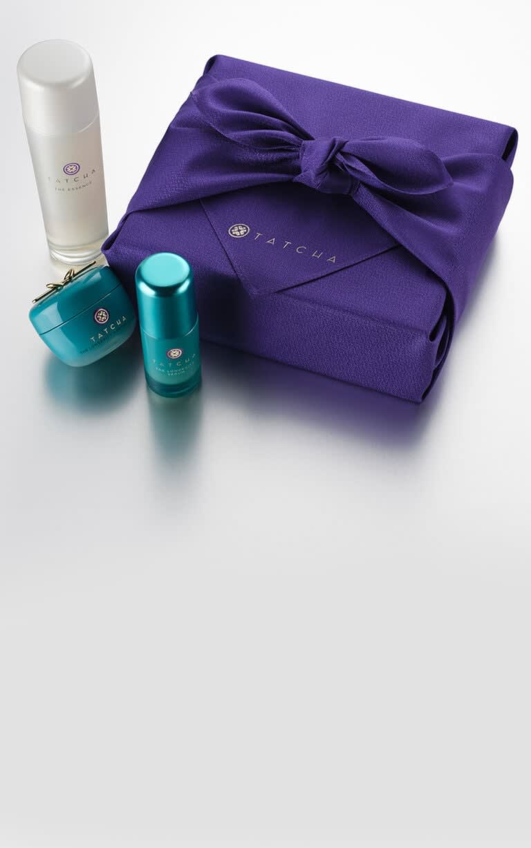 tatcha products with box wrapped in purple furoshiki