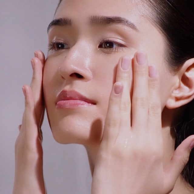 Woman washing face