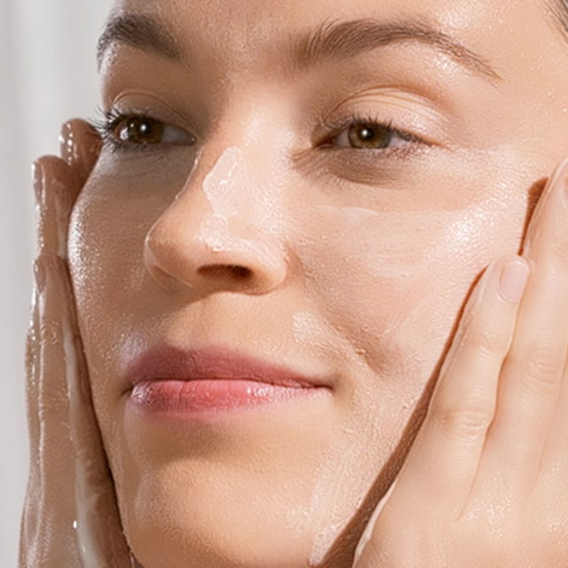 Woman washing face