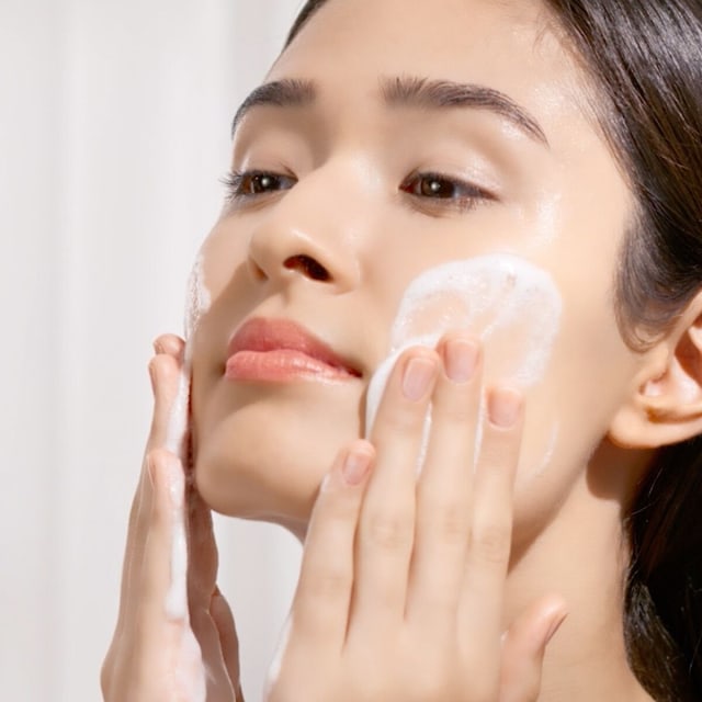 Woman washing face