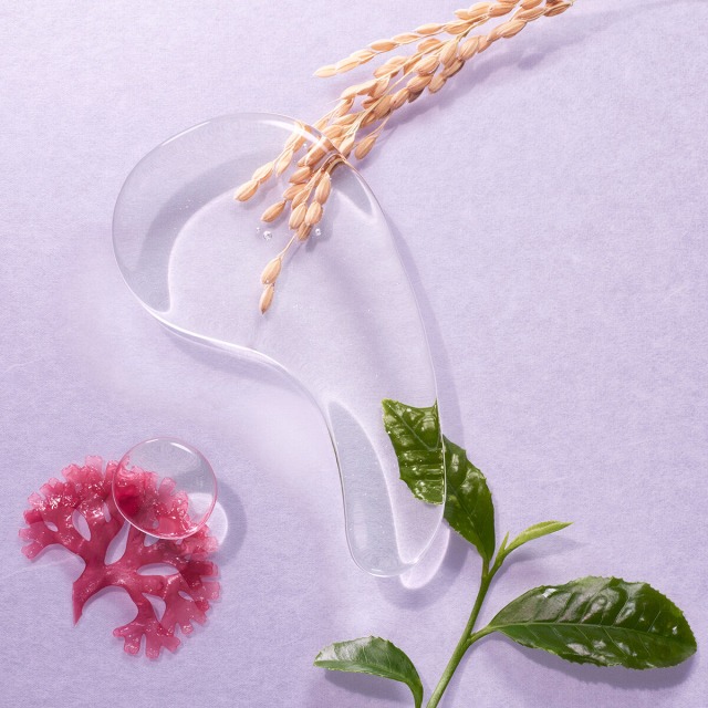 Texture shot of The Essence featuring Akita rice, Uji green tea, and Okinawa algae ingredients.