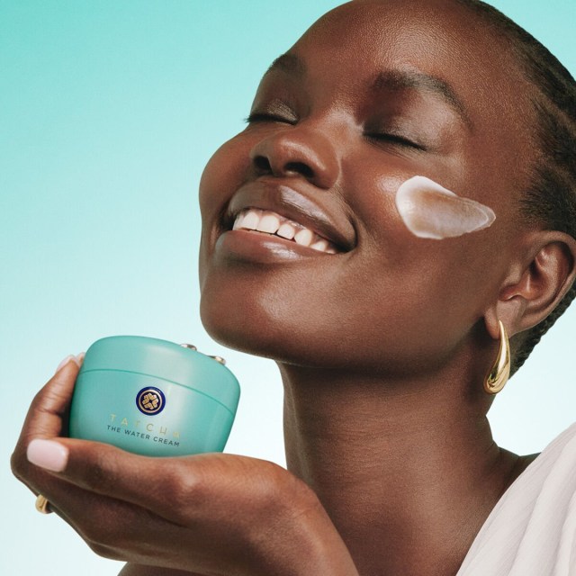 Woman applying The Water Cream to her face