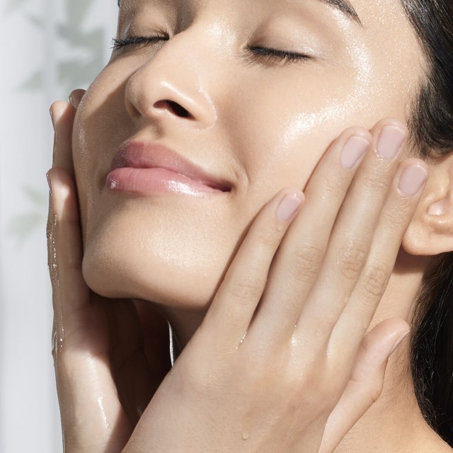 Woman applying the Essence